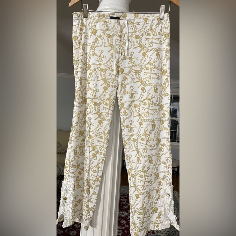 Baby phat women’s 100% cotton pants crame and shiny gold . Chain , logo print